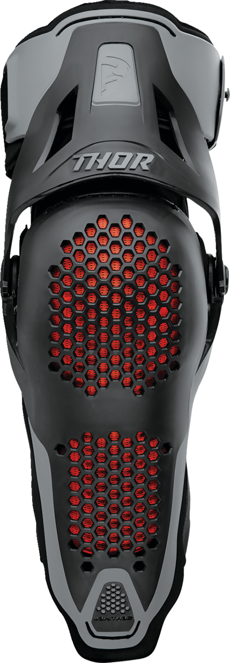 Black THOR Sentinel knee guards in S/M size, protective sports gear with padded support and adjustable straps for knee protection.