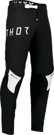 Black and white THOR Sportmode Strike offroad ATV pants, US size 30, featuring durable fabric and sporty design.