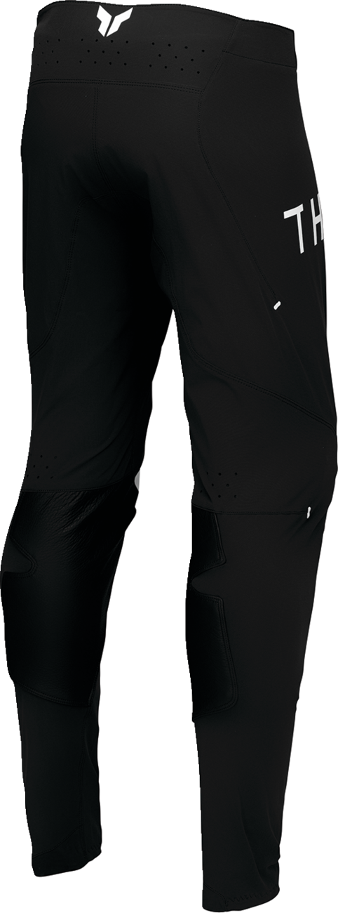 Black and white THOR Sportmode Strike ATV pants with US size 30, designed for off-road motocross riding.