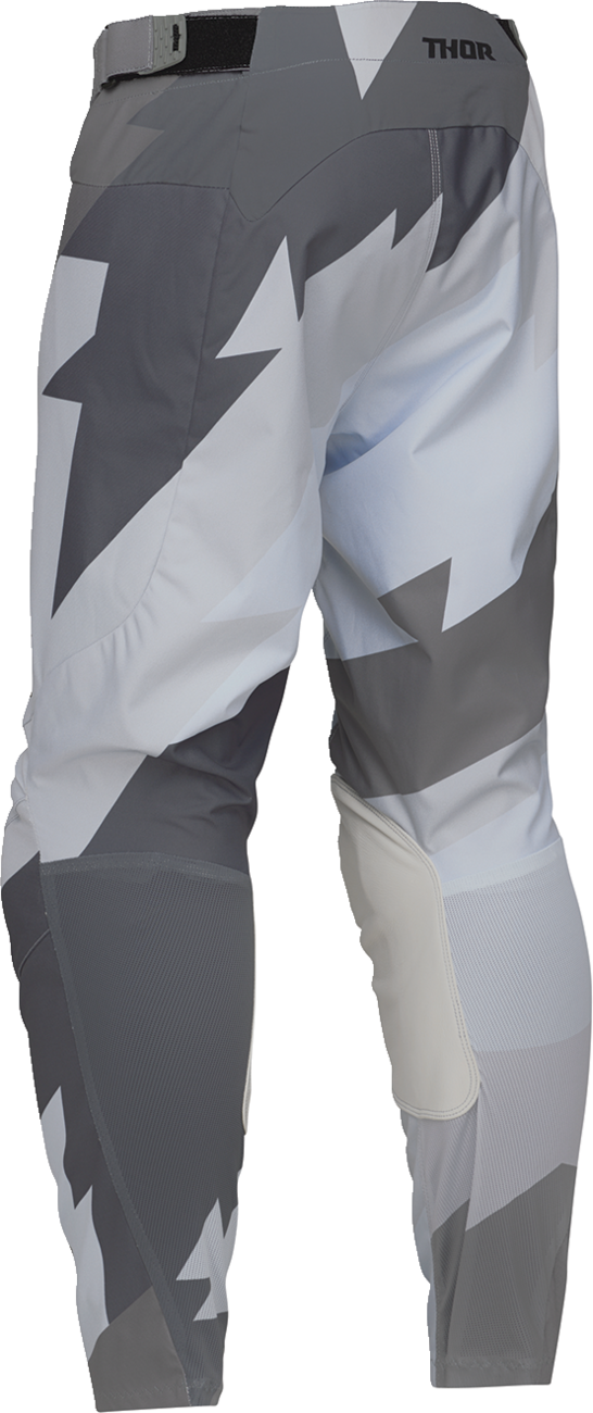 Black and gray THOR Launchmode Brave ATV pants in US size 40, designed for off-road riding with durable, protective features.