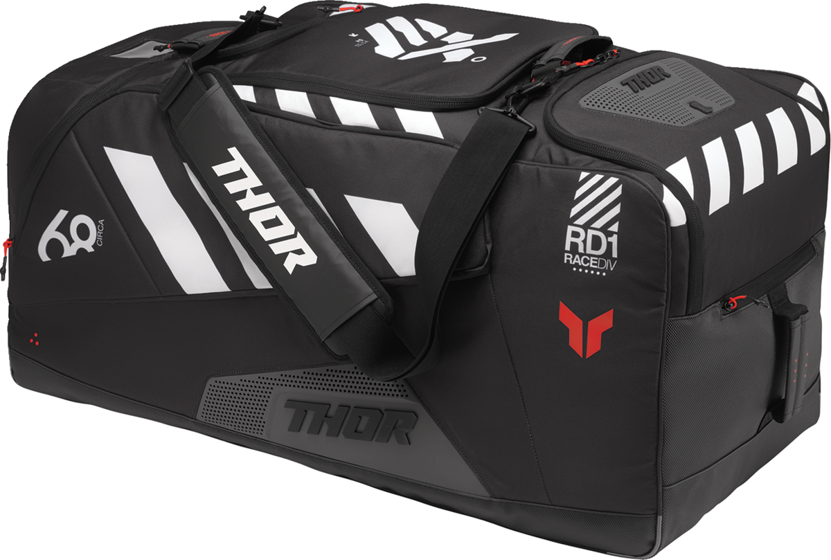 Black and coral THOR Circuit luggage bag with sturdy handles and spacious compartments, designed for travel convenience.