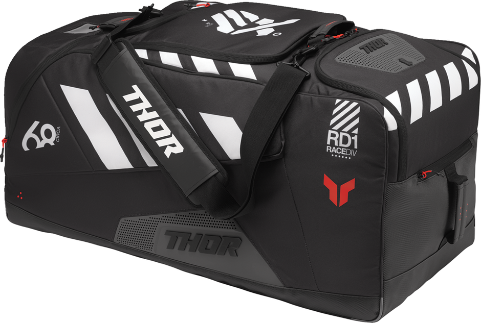Black and coral THOR Circuit luggage bag with sturdy handles and spacious compartments, designed for travel convenience.