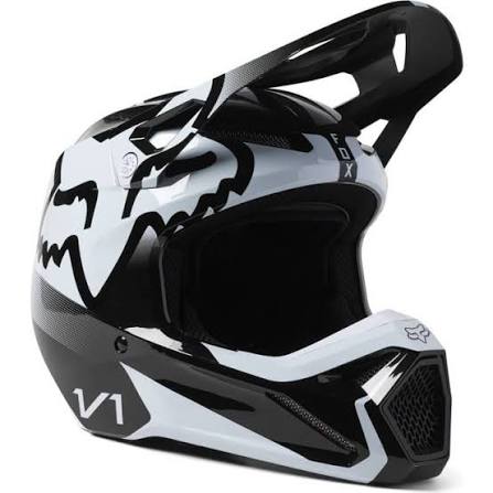 FOX Racing V1 Shield helmet with adjustable visor and ventilation, shown in a sleek black design for motocross riding.